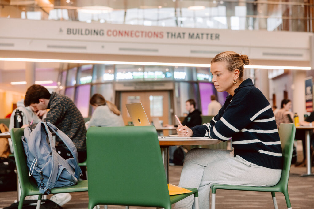 Student studying in Ryan Center for Business Studies